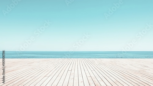 A serene beach scene featuring a wooden deck against a calm sea under a clear blue sky, perfect for relaxation and inspiration.