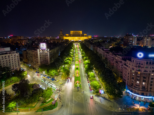 Aerial Drone point of view of Unirii Water Fountains illuminated at night. City center of Bucharest at night. Light shows every weekend, in summer. Capital cities. #1001011935