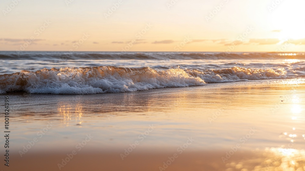Fototapeta premium Gentle waves lapping at a serene sunset beach
