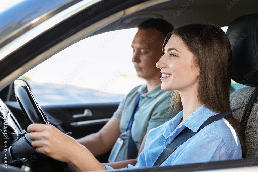 Driving school. Student passing driving test with examiner in car Driving school. Student passing driving test with examiner in car