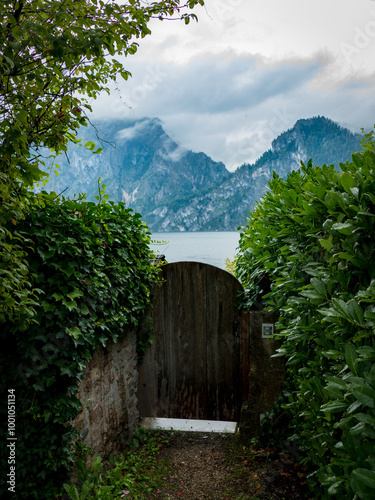 Wallpaper Mural wooden house in the mountains with a gate to the lake Torontodigital.ca