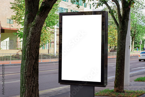 Vertical blank white street billboard in the city. Advertising banner with copy space. Mock up