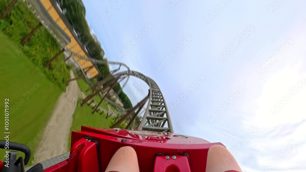 First-Person View Of Red Roller Coaster Ride Through Tunnel And Beyond