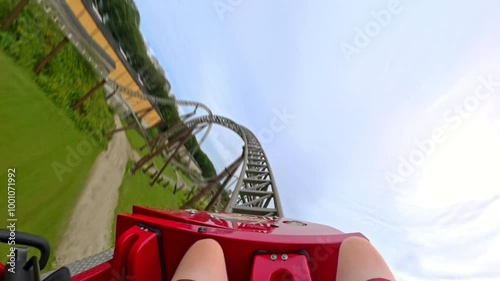 First-Person View Of Red Roller Coaster Ride Through Tunnel And Beyond