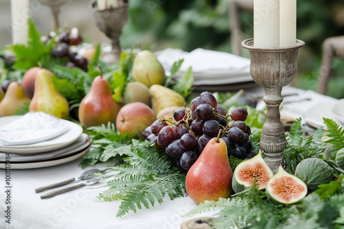 A beautifully set dining table party for an outdoor wedding, featuring a pristine white tablecloth and rustic woodfern candleholders decorated with delicate fruits and flowers,
 photo