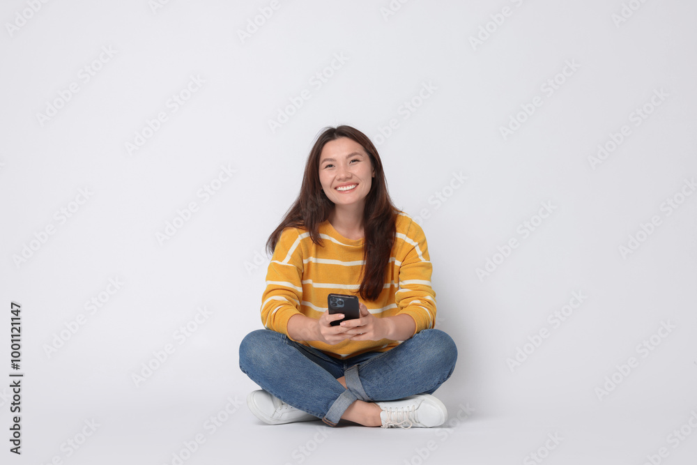 Smiling woman with smartphone on white background Smiling woman with smartphone on white background