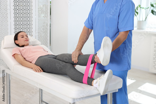 Physiotherapist working with patient in rehabilitation center