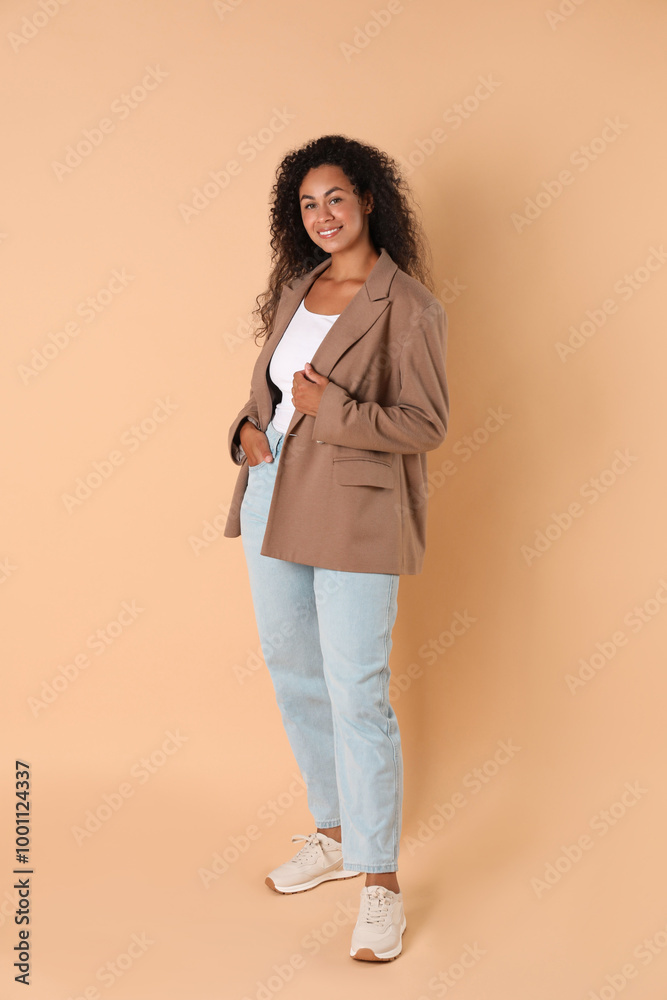 Beautiful woman in stylish jacket on beige background Beautiful woman in stylish jacket on beige background
