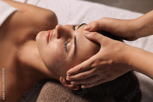 Fotografie Attractive woman enjoying face massage, closeup. Beauty procedure