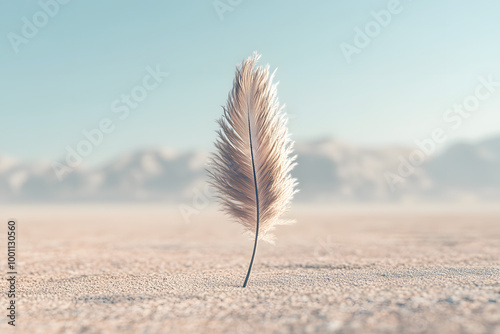 Single feather standing upright in a desert landscape, symbolizing lightness and resilience. Minimalist nature scene capturing serenity, balance, and tranquility in the simplicity of the vast wild photo