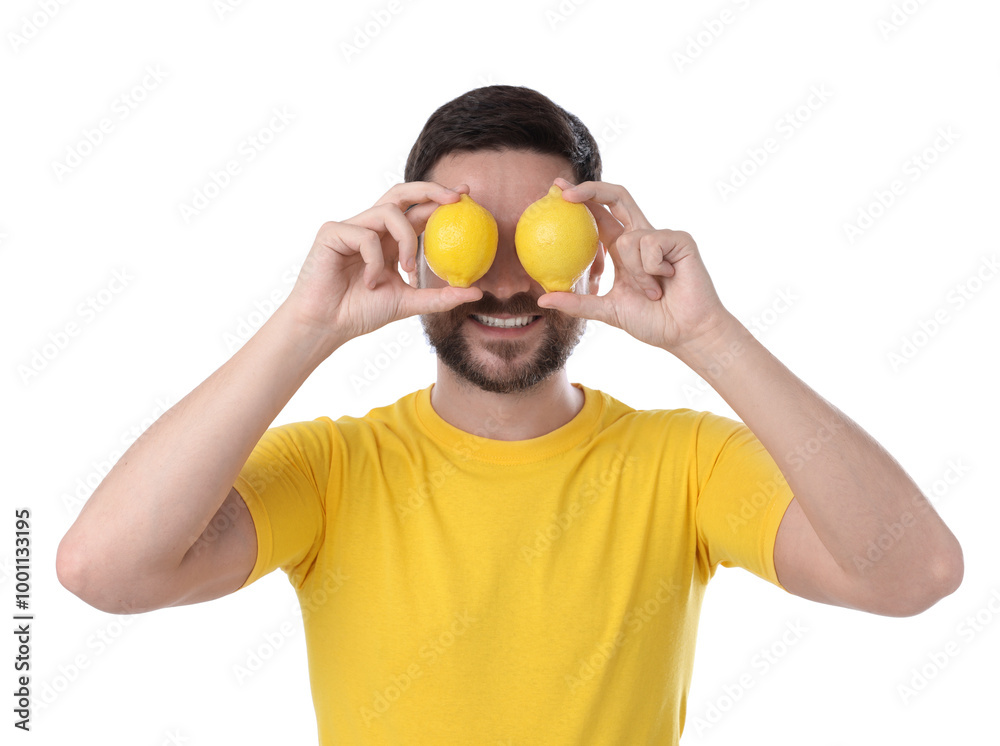 Happy man covering eyes with lemons on white background Happy man covering eyes with lemons on white background