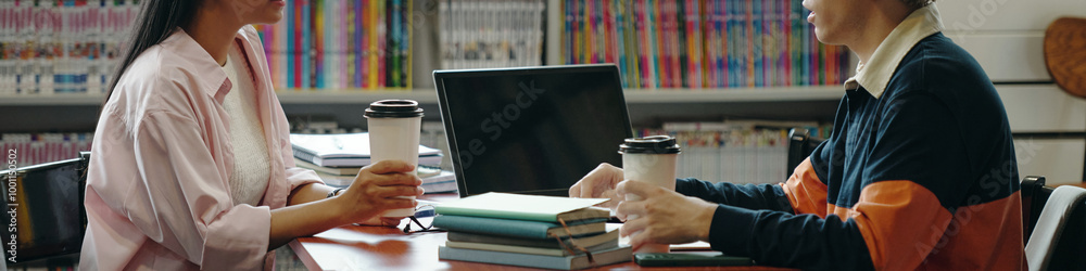 © DragonImages - Header with students studying in the library