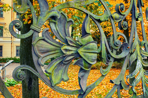 St Petersburg Russia. Architecture metal elements in form of flowers and leaves at art metal fence of Michael garden in St Petersburg, Russia photo