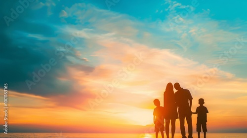 Happy family silhouette against stunning sunset sky,  beautiful nature landscape evoking family vacation concept.
