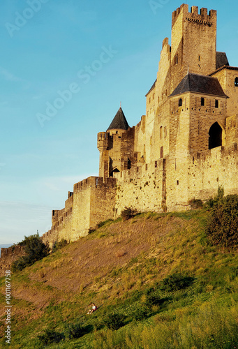 Dramatic view of Carcassonne castle sunset light photo