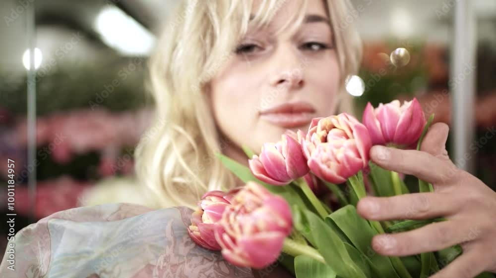 Beautiful Girl Playing with Flowers in Flower Shop Beautiful Girl Playing with Flowers in Flower Shop