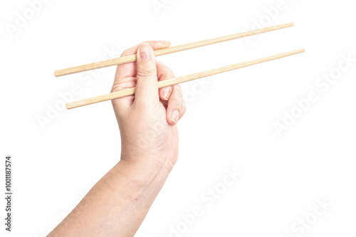 Female hand holding a wood chopstick isolated on white background.