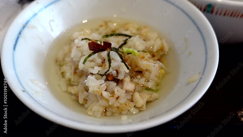 Ochazuke hot tea over rice seafood and seaweed Japanese traditional cuisine 4k Ochazuke hot tea over rice seafood and seaweed Japanese traditional cuisine 4k