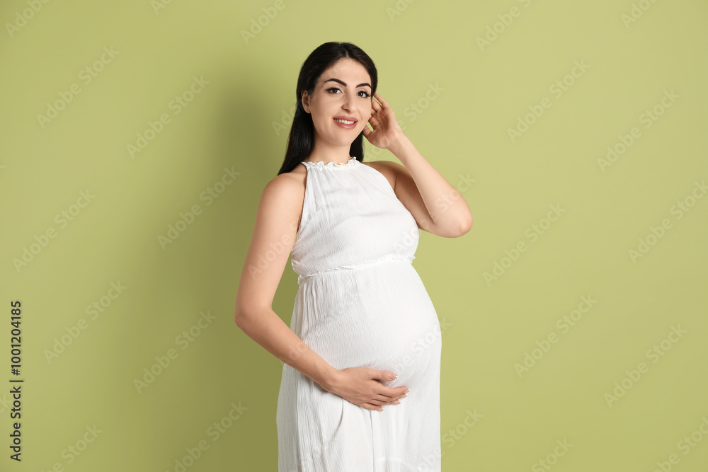 Portrait of beautiful pregnant woman on light olive background Portrait of beautiful pregnant woman on light olive background