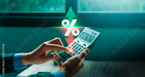 Variable Interest Rates, Business Professional Analyzing Fluctuating Interest Rates Using a Calculator to Make Strategic Financial Decisions and Optimize Investment Returns photo