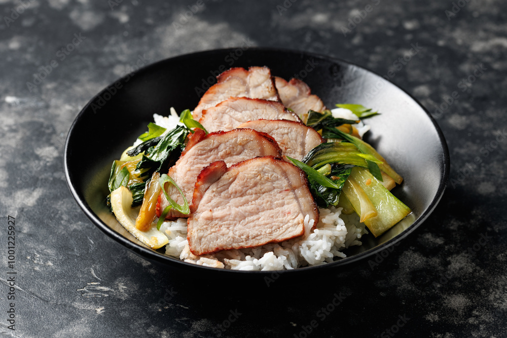 Chinese BBQ Pork Char Siu with rice and bok choy in a black bowl Chinese BBQ Pork Char Siu with rice and bok choy in a black bowl