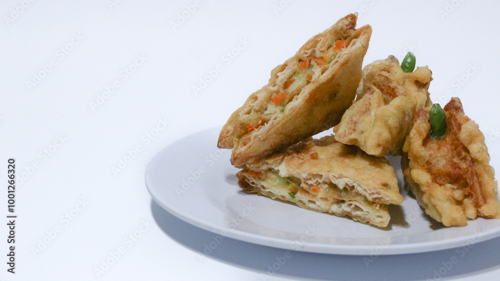 Roti Goreng is common fritter snack in Indonesia which made of white bread filled with creamy chicken and vegetable. Roti Goreng is common fritter snack in Indonesia which made of white bread filled with creamy chicken and vegetable.