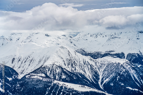 View on winter mpuntains from Eggishorn peak, Alps. photo