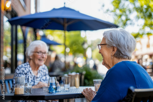 Senior Women Enjoying Conversation at Outdoor Cafe