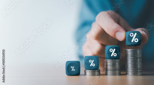 Businessman putting percentage sign on increasing coins money for financial banking increase interest rate or mortgage investment dividend from business growth concept. photo