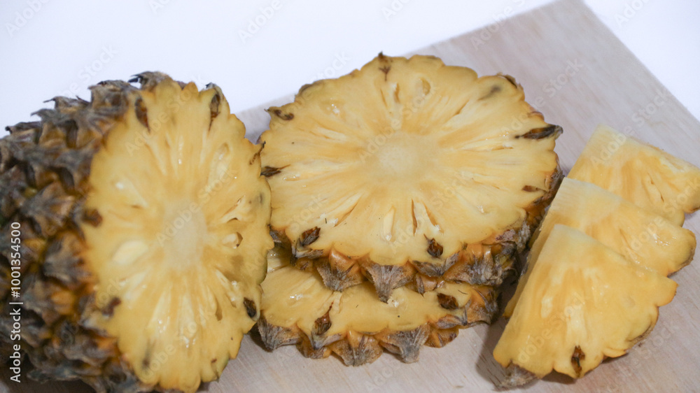 fresh juicy pineapple pieces isolated on white background fresh juicy pineapple pieces isolated on white background