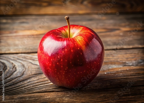 A vibrant, juicy red apple with subtle highlights and gentle shadows, resting on a rustic wooden table, evoking a sense of autumnal simplicity and freshness. photo