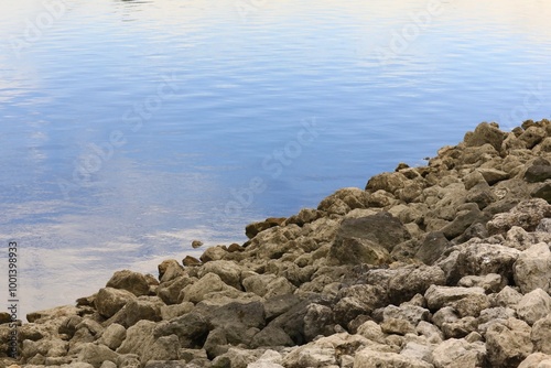 Reservoir of freshwater near a rock piled dam