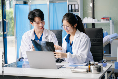  Doctor Talks With Professional Head Nurse or Surgeon, They Use Digital tablet Computer. Diverse Team of Health Care