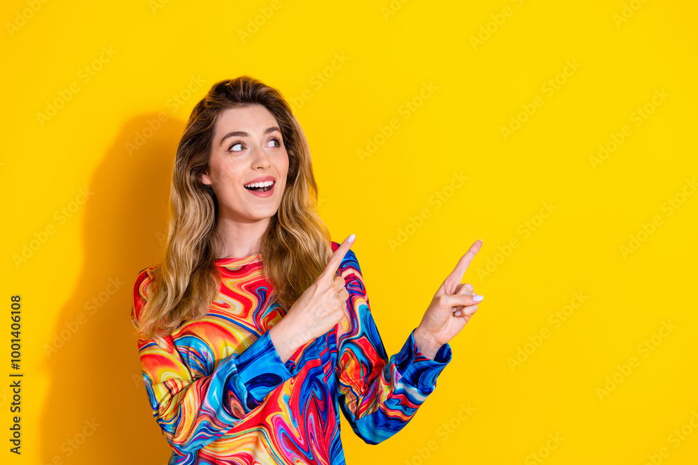 Photo of young blonde hair sales woman wearing colorful pullover advertising point fingers real estate isolated on yellow color background Photo of young blonde hair sales woman wearing colorful pullover advertising point fingers real estate isolated on yellow color background