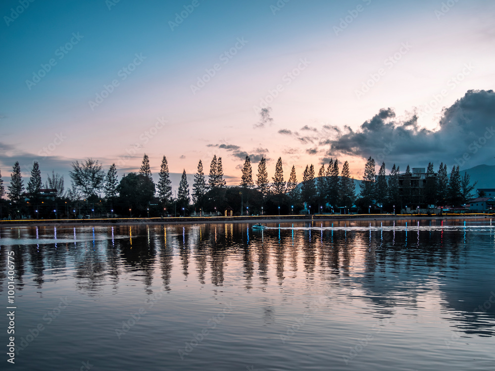 Naklejka premium The riverside of the Praek Tuek Chhu River in Kampot in Cambodia at sunset