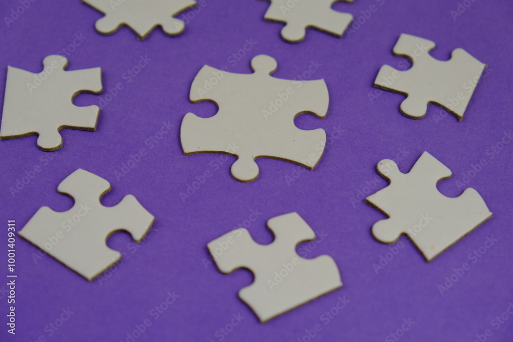 white jigsaw puzzle with missing puzzle for a text template. Above photo of isolated on the purple background white jigsaw puzzle with missing puzzle for a text template. Above photo of isolated on the purple background