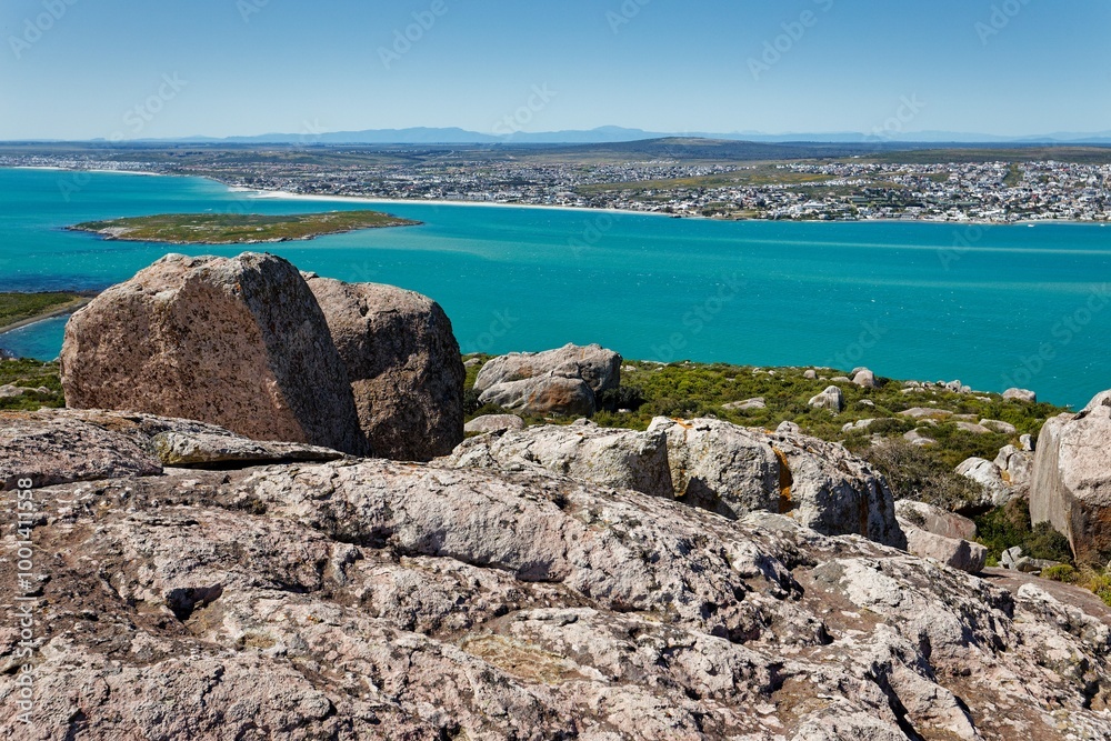A view over the Langebaan lagoon, Western Cape, South Africa, with large rocks in the foreground. A view over the Langebaan lagoon, Western Cape, South Africa, with large rocks in the foreground.