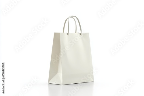Plain white paper shopping bag with sturdy handles isolated on white photo
