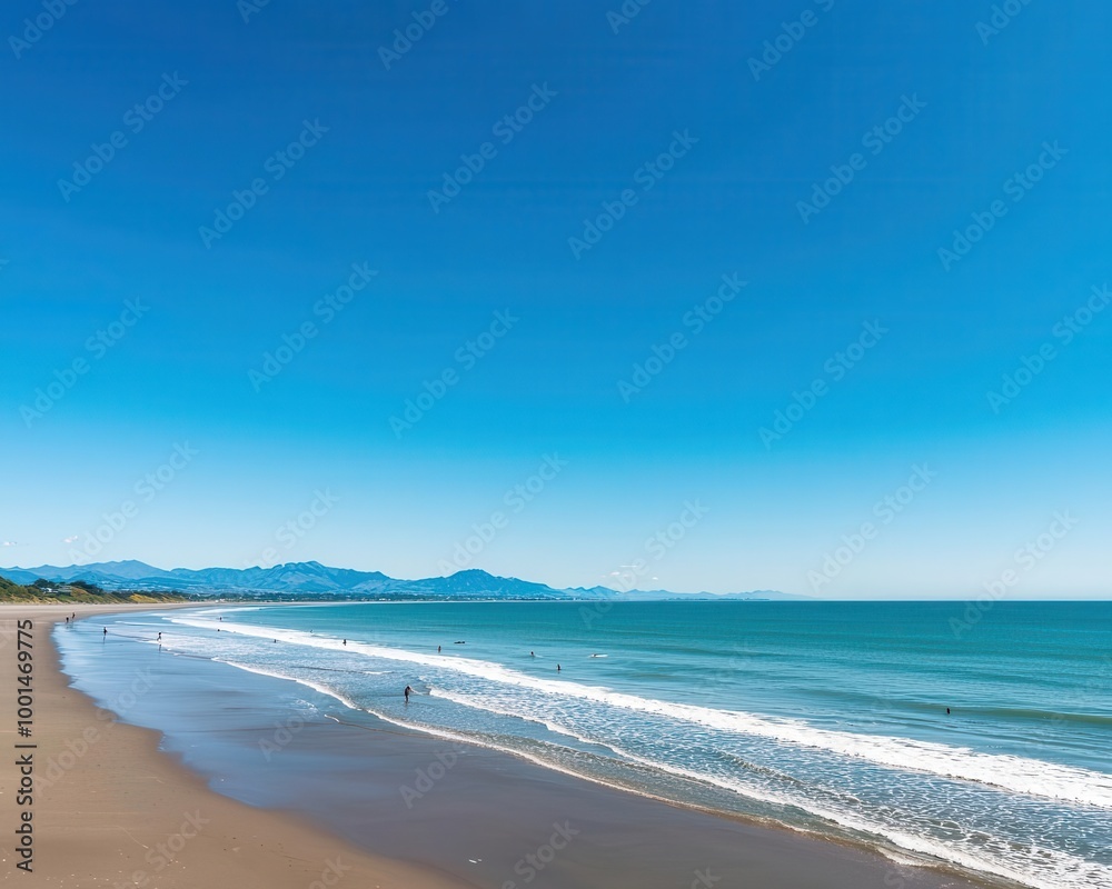 A sunny day at New Brighton Beach, with surfers catching waves and families enjoying the scenic Christchurch coastline A sunny day at New Brighton Beach, with surfers catching waves and families enjoying the scenic Christchurch coastline