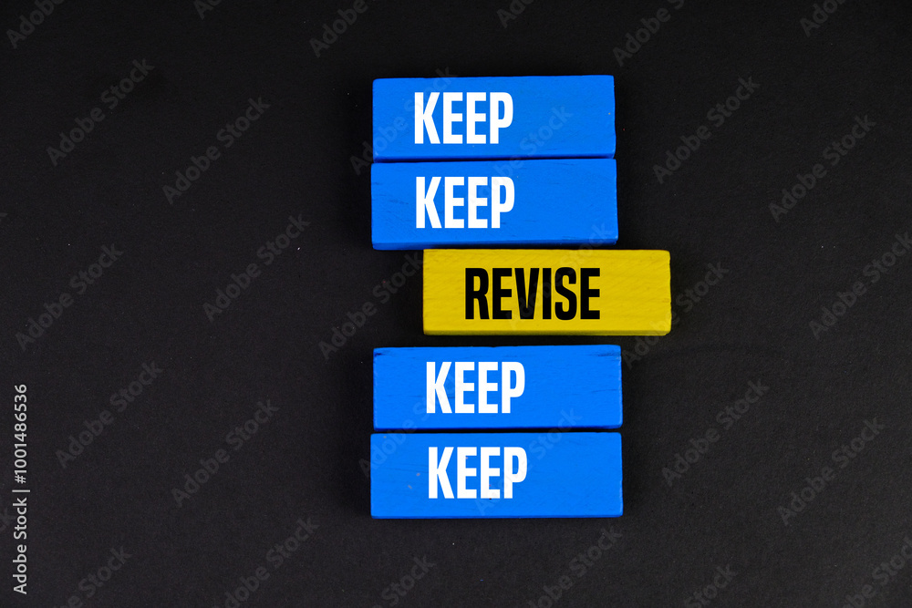 TIME TO REVISE words as a changes, election or decision making concept. hand element and yellow wooden block on plain background. TIME TO REVISE words as a changes, election or decision making concept. hand element and yellow wooden block on plain background.