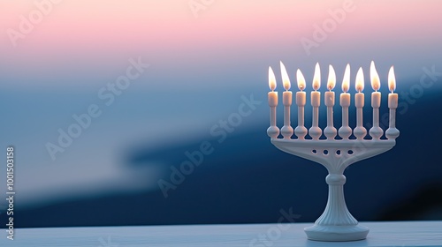 A serene scene featuring a lit menorah against a soft, colorful sunset backdrop, symbolizing celebration and tradition.