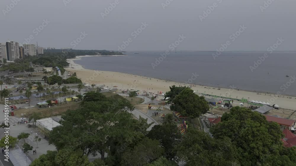 Drone flies up and away from letter sign at Praia da Ponta Negra beach in Manaus, Amazonas, Brazil Drone flies up and away from letter sign at Praia da Ponta Negra beach in Manaus, Amazonas, Brazil