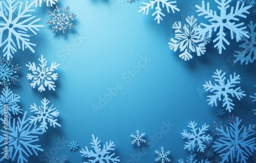 decorative snowflakes on a blue photo with a copy space