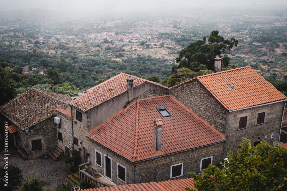 Portuguese houses in the village of Monsanto, Portugal, into the fog. Portuguese houses in the village of Monsanto, Portugal, into the fog.