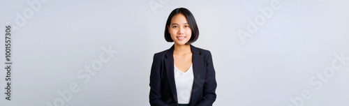 A portrait of a Southeast Asian businesswoman in a black jacket style.