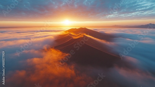 foggy desert landscape with sand dunes covered in thick morning fog, aerial view by drone capturing serene and remote wilderness, calm atmosphere and misty dunes at sunrise