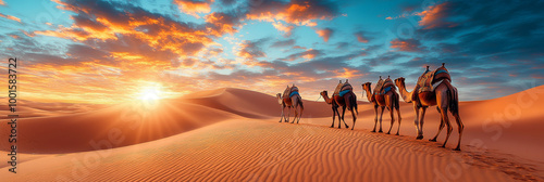Obraz na płótnie A caravan of camels walks across a vast desert landscape at sunset. w salonie