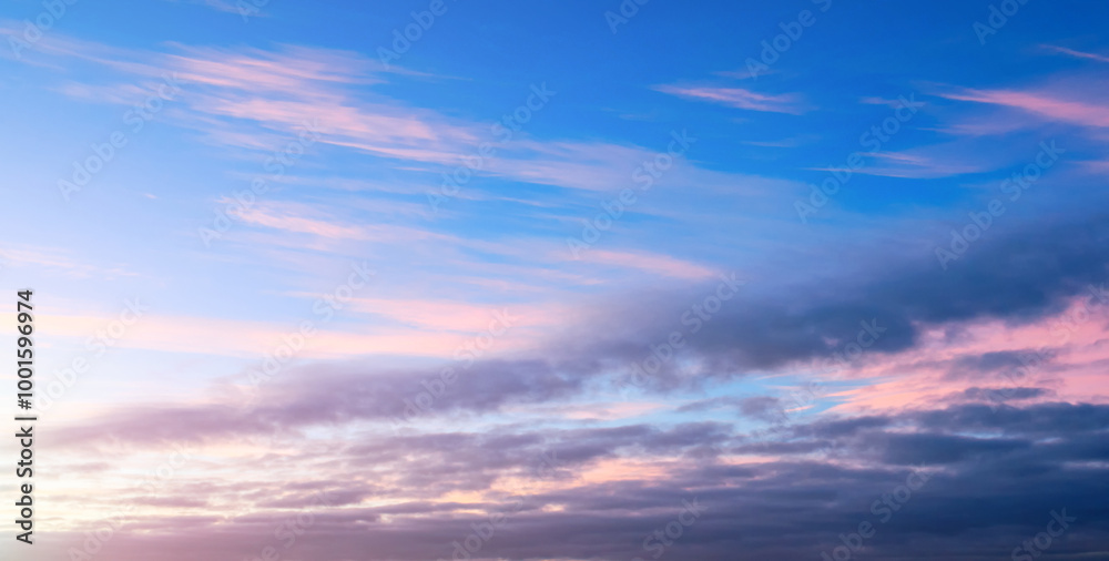 Sunset sky with pink and blue clouds, wide angle panoramic view of colorful sunset sky. Vast sunset sky landscape in picturesque tones Sunset sky with pink and blue clouds, wide angle panoramic view of colorful sunset sky. Vast sunset sky landscape in picturesque tones