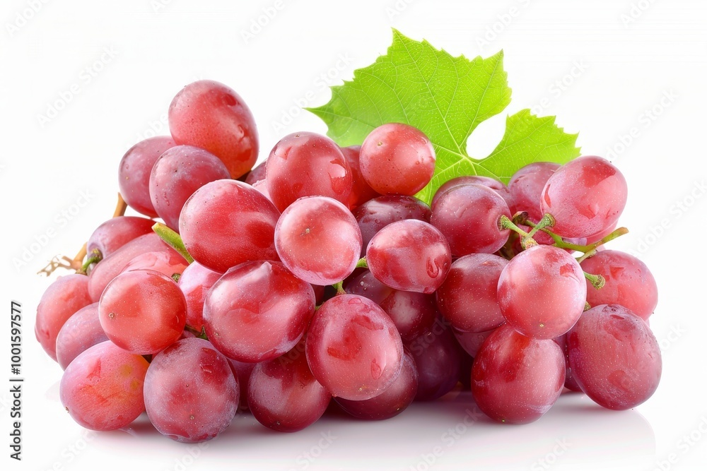 Fototapeta premium Fresh red grapes intertwined with lush green leaves on a bright white background, perfect for design