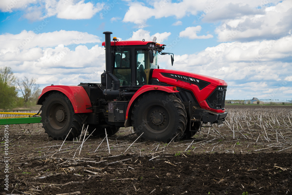 Fototapeta premium Tractor close-up. Agricultural machinery in the field